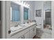 Bathroom features double vanity, large mirror and tile flooring at 4723 Sabal Key Dr, Bradenton, FL 34203