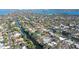 Aerial view highlighting a home's waterfront location and pool at 5072 Higel Ave, Sarasota, FL 34242