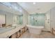Large bathroom with soaking tub and walk-in shower at 5072 Higel Ave, Sarasota, FL 34242