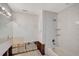 Under renovation bathroom with new white tile and bathtub at 5072 Higel Ave, Sarasota, FL 34242