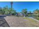 Property showcasing canal front with boat lifts and dock at 5072 Higel Ave, Sarasota, FL 34242