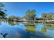 Beautiful view of the canal with boats and lush landscaping at 5072 Higel Ave, Sarasota, FL 34242
