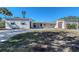 Contemporary home exterior with paver driveway and landscaping at 5072 Higel Ave, Sarasota, FL 34242