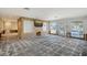 Renovation project: Spacious living area with large windows and water view at 5072 Higel Ave, Sarasota, FL 34242