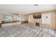Renovation project: large living room with pool view and built-in entertainment center at 5072 Higel Ave, Sarasota, FL 34242