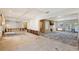 Spacious living room with hardwood floors and large windows, currently under renovation at 5072 Higel Ave, Sarasota, FL 34242
