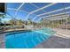 Screened pool and patio with canal view at 5072 Higel Ave, Sarasota, FL 34242