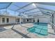 Large screened pool area with patio and canal view at 5072 Higel Ave, Sarasota, FL 34242