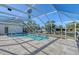 Screened pool and patio with canal view at 5072 Higel Ave, Sarasota, FL 34242