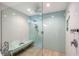 Spacious walk-in shower with dual shower heads and bench at 5072 Higel Ave, Sarasota, FL 34242