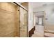 Shower with sliding glass doors and tiled walls at 5072 Higel Ave, Sarasota, FL 34242
