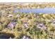 Aerial view of lakefront property and neighborhood at 5131 Willow Leaf Dr, Sarasota, FL 34241