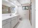 Bathroom with a large vanity, shower, and window at 5131 Willow Leaf Dr, Sarasota, FL 34241