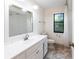 Clean bathroom, featuring a white vanity and stone-look tile floors at 5131 Willow Leaf Dr, Sarasota, FL 34241