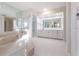 Spa-like bathroom with soaking tub, walk-in shower, and double vanity at 5131 Willow Leaf Dr, Sarasota, FL 34241