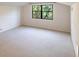 Spacious bedroom with carpeted floors and large windows at 5131 Willow Leaf Dr, Sarasota, FL 34241