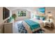 Bright bedroom featuring coastal decor, a view of nature, and a comfortable bed at 5131 Willow Leaf Dr, Sarasota, FL 34241