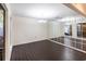 Spacious dining room with dark hardwood floors and mirrored wall at 5131 Willow Leaf Dr, Sarasota, FL 34241