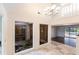 Bright entryway with high ceilings and views of a courtyard at 5131 Willow Leaf Dr, Sarasota, FL 34241