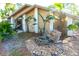 Landscaped front yard with a stone fountain at 5131 Willow Leaf Dr, Sarasota, FL 34241