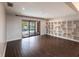 Gathering room with dark hardwood floors and pool view at 5131 Willow Leaf Dr, Sarasota, FL 34241