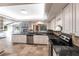 Bright kitchen features white cabinets, granite countertops, and stainless steel appliances at 5131 Willow Leaf Dr, Sarasota, FL 34241