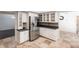Kitchen boasts white cabinets, granite countertops, and stainless steel appliances at 5131 Willow Leaf Dr, Sarasota, FL 34241
