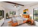 Bright main bedroom featuring high ceilings, a ceiling fan, and a natural view at 5131 Willow Leaf Dr, Sarasota, FL 34241