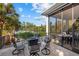 Waterfront patio with fire pit and seating area at 5246 Avenida Del Mare, Sarasota, FL 34242