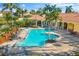 Resort-style pool with spa and lounge chairs at 606 Riviera Dunes Way # 404, Palmetto, FL 34221