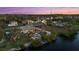 Stunning waterfront property with a private dock and beautiful landscaping at 609 Elba Dr, Nokomis, FL 34275