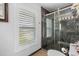 Bathroom featuring a walk-in shower and window at 609 Elba Dr, Nokomis, FL 34275