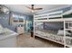 bedroom with bunk bed, carpet, and ample storage at 609 Elba Dr, Nokomis, FL 34275