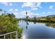 Scenic view of a tranquil canal with lush vegetation and clear waters at 609 Elba Dr, Nokomis, FL 34275