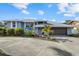 House exterior featuring a modern garage door and landscaping at 609 Elba Dr, Nokomis, FL 34275