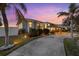 Charming home exterior with a landscaped yard and driveway at 609 Elba Dr, Nokomis, FL 34275