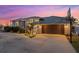 Home exterior showcasing a modern garage door at dusk at 609 Elba Dr, Nokomis, FL 34275