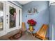 Welcoming front porch with seating and festive holiday decor at 609 Elba Dr, Nokomis, FL 34275