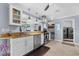 Well-equipped kitchen featuring granite countertops and modern appliances at 609 Elba Dr, Nokomis, FL 34275