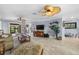Spacious living area with a comfortable seating arrangement and access to the outdoors at 609 Elba Dr, Nokomis, FL 34275