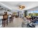 Open living space with a drum set, access to kitchen and dining areas at 609 Elba Dr, Nokomis, FL 34275