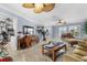 Open concept living room with kitchen views and comfortable seating at 609 Elba Dr, Nokomis, FL 34275
