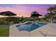Inviting pool area with patio and stunning sunset view at 609 Elba Dr, Nokomis, FL 34275