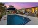 Relaxing pool area with patio, deck and covered lanai at 609 Elba Dr, Nokomis, FL 34275