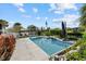 Relaxing pool area with a waterfall feature and plenty of lounge space at 609 Elba Dr, Nokomis, FL 34275