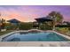 Inviting swimming pool with a tranquil water feature, perfect for relaxation at 609 Elba Dr, Nokomis, FL 34275