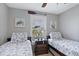 Cozy bedroom with twin beds and beach-themed decor at 6250 Holmes Blvd # 32, Holmes Beach, FL 34217