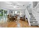 Bright dining area features a staircase, a ceiling fan, and sliding doors for easy access to outdoor spaces at 6250 Holmes Blvd # 32, Holmes Beach, FL 34217