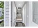 Bright entryway with staircase leading upstairs at 6250 Holmes Blvd # 32, Holmes Beach, FL 34217