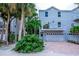 Two-story beach home with private driveway and tropical landscaping at 6250 Holmes Blvd # 32, Holmes Beach, FL 34217